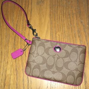 Pink and brown Coach wristlet